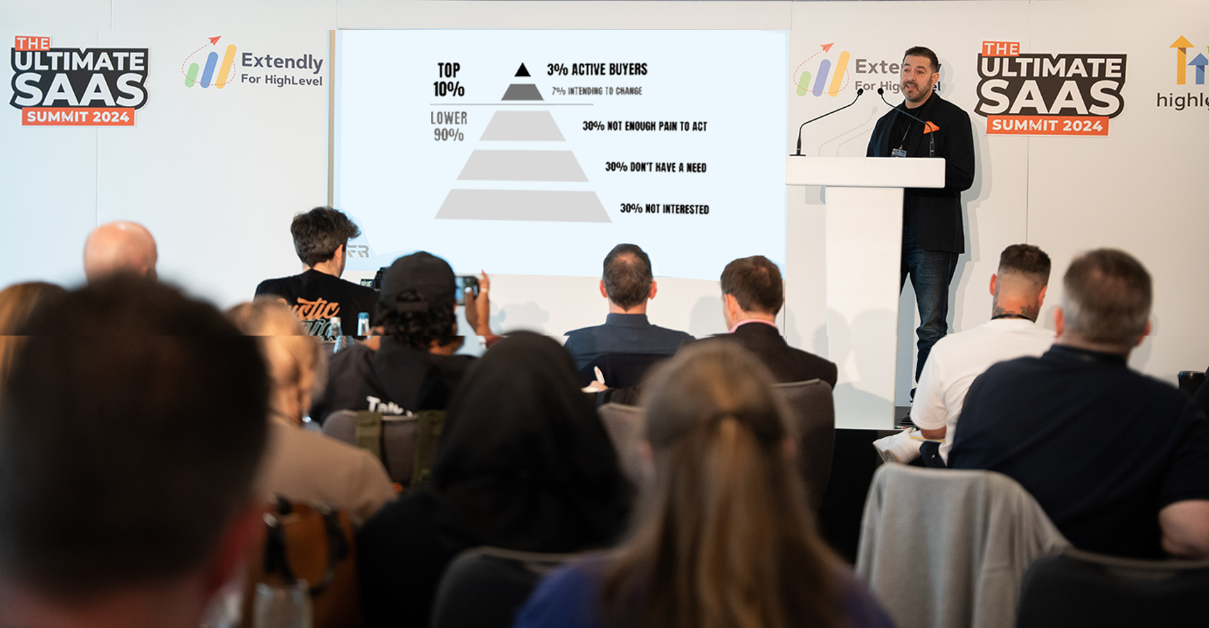 Francis Rodino speaking on stage